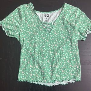 A juniors floral green top in size small.